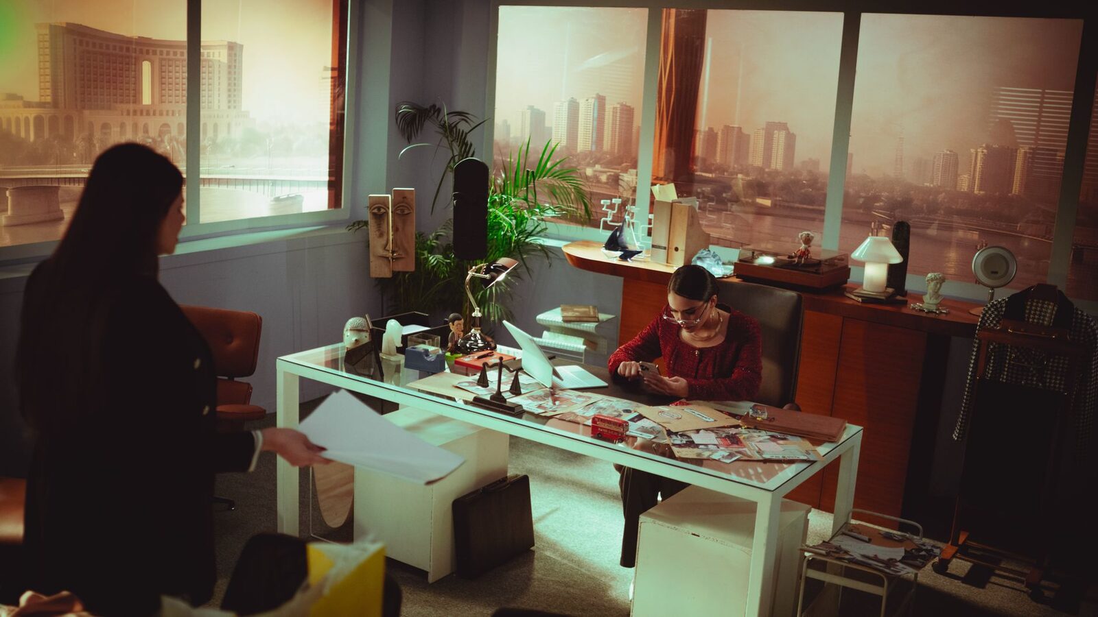 Professional office setting with two adults engaged in work in Baghdad, Iraq.